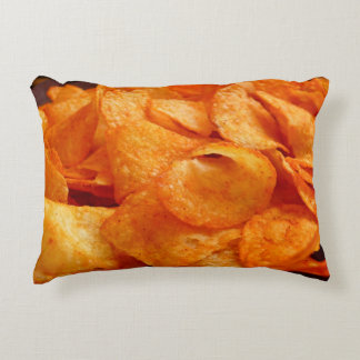 Close up of juicy, crispy, chips on black plate. decorative cushion