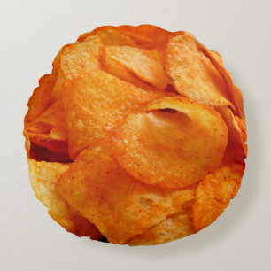 Close up of juicy, crispy, chips on black plate. round cushion