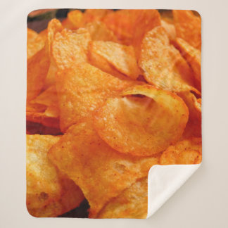 Close up of juicy, crispy, chips on black plate. sherpa blanket