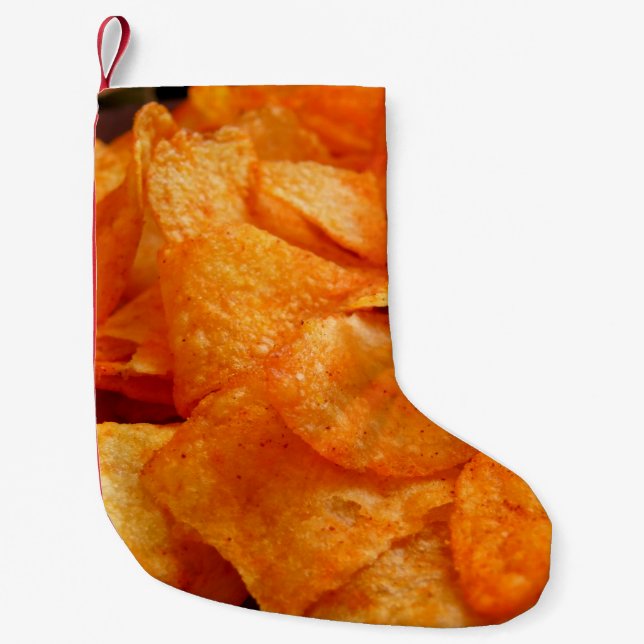 Close up of juicy, crispy, chips on black plate. small christmas stocking (Front)