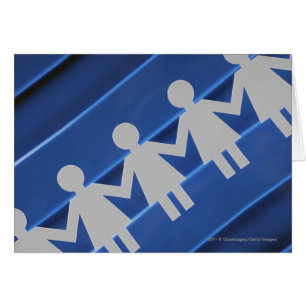 Close-up of paper chain dolls