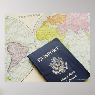 Close-up of passport lying on map poster