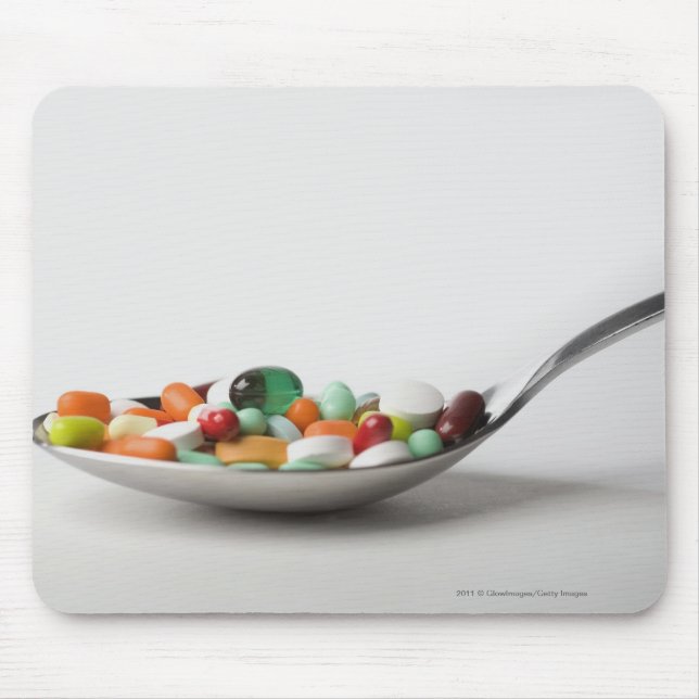 Close-up of pills in a spoon mouse mat (Front)