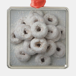 Close-up of powdered doughnuts in a plate metal tree decoration