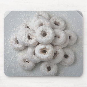 Close-up of powdered doughnuts in a plate mouse mat