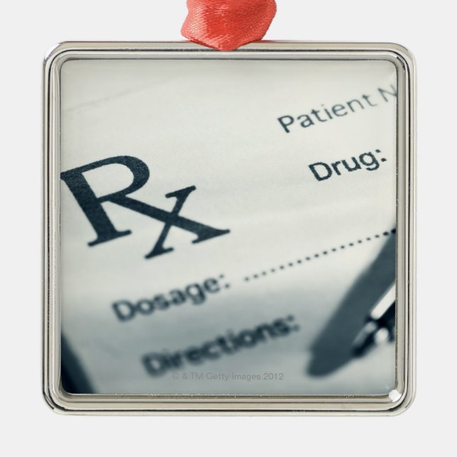 Close up of prescription pad and pen metal tree decoration (Front)