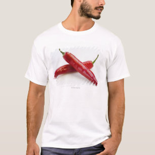 Close up of red chilli peppers on white T-Shirt