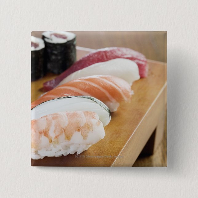 Close-up of sushi on a table 15 cm square badge (Front)