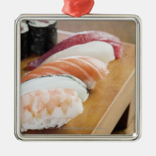 Close-up of sushi on a table metal tree decoration