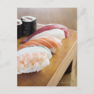Close-up of sushi on a table postcard