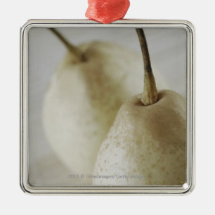 Close-up of two pears metal tree decoration