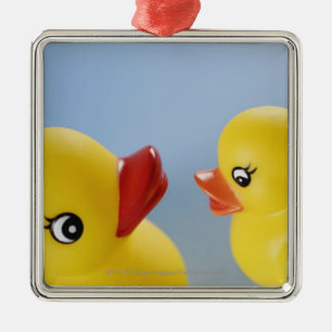 Close-up of two rubber ducks metal tree decoration