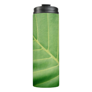 Close up photo of green leaf thermal tumbler