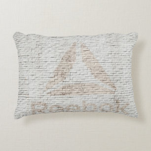 Close-up photo of Reebok logo on wall Decorative Cushion