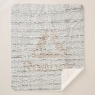 Close-up photo of Reebok logo on wall Sherpa Blanket