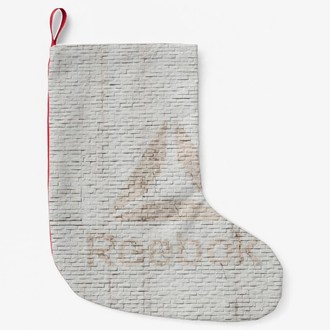 Close-up photo of Reebok logo on wall Small Christmas Stocking (Front)