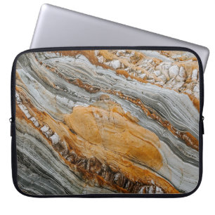 Close-up photography of grey and orange stones laptop sleeve