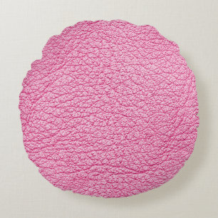 Close-up pink leather, textured background. round cushion