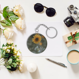 close-up shot of sunflower keychain. keychain