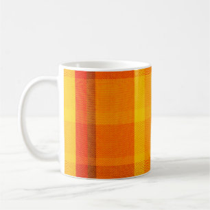 close-up texture with a chequered cloth coffee mug