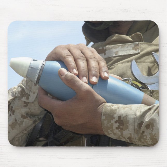Close-up view of a soldier cradling a munition mouse mat (Front)