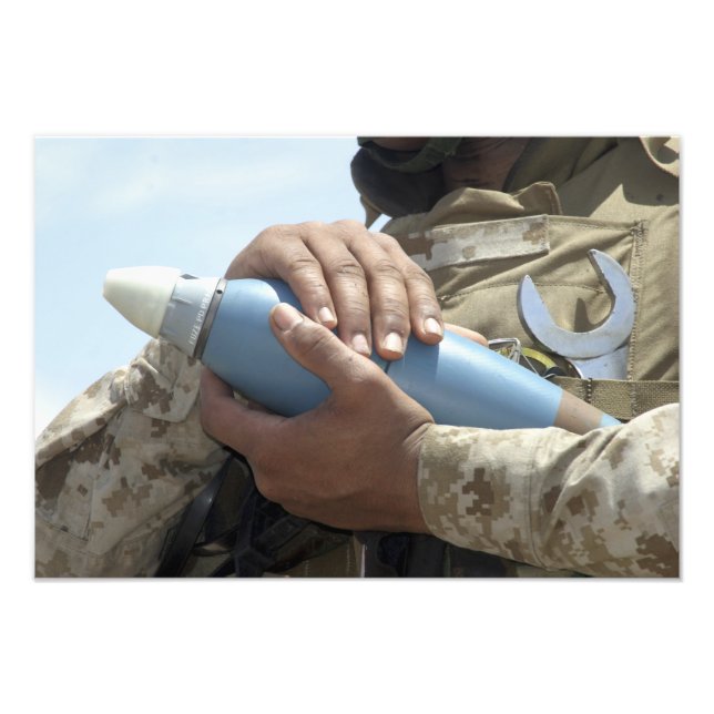 Close-up view of a soldier cradling a munition photo print (Front)