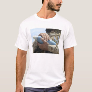 Close-up view of a soldier cradling a munition T-Shirt