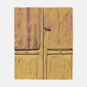 Closed brown wooden cabinet fleece blanket