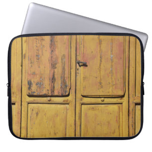 Closed brown wooden cabinet laptop sleeve
