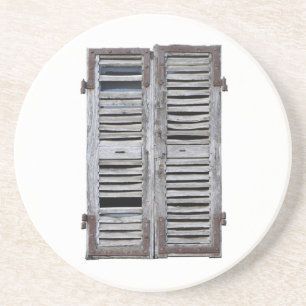 Closed window with old wood shutters coaster
