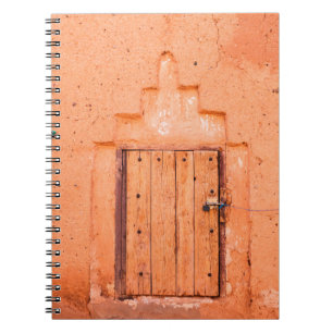 Closed wooden window in traditional moroccan house notebook