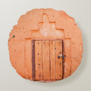 Closed wooden window in traditional moroccan house round cushion
