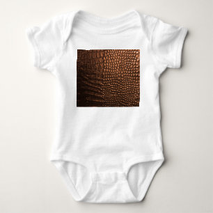 Closeup: crocodile leather texture. baby bodysuit