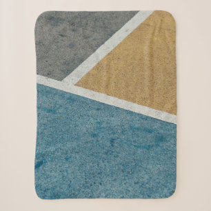 Closeup gray, yellow, and blue painted pavement sherpa blanket