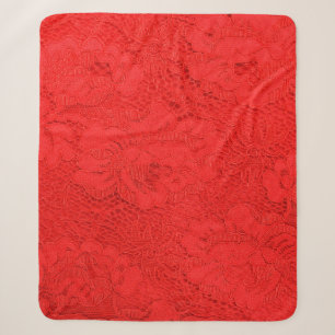 Closeup of fine elegant red lace texture with seam sherpa blanket