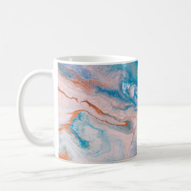Closeup of mixed blue and white abstract marble te coffee mug (Left)