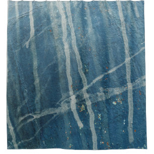 Closeup photo of blue wall paint shower curtain