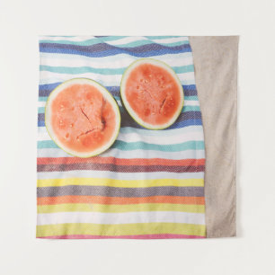 Closeup photo of slice watermelon fruits on cloth tapestry