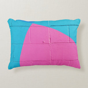 Closeup photo of teal and pink wall decorative cushion