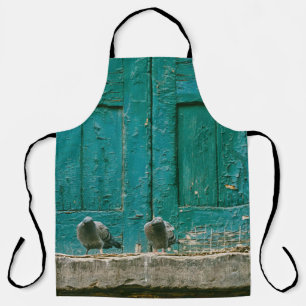 CLOSEUP PHOTO OF TWO GRAY PIGEONS ON GRAY CONCRETE APRON