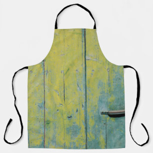 Closeup photo of yellow and teal wooden board apron