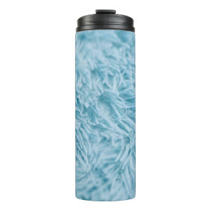 CLOSEUP PHOTOGRAPHY OF BLUE TEXTILE THERMAL TUMBLER