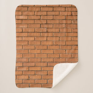 Closeup photography of brown brick wall sherpa blanket