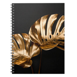 Closeup view of natural gold painted monstera trop notebook