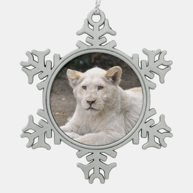 Closeup white lion cub lying on ground  snowflake pewter christmas ornament (Front)