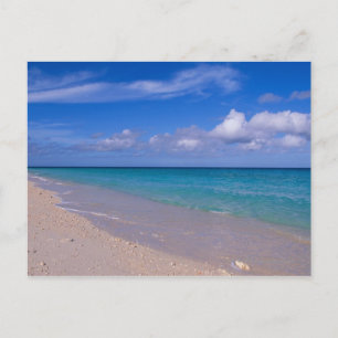 Cloud in blue sky over sandy beach postcard