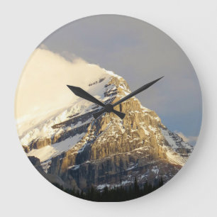 Clouds Roll Off Snowy Mountain in Canada Large Clock