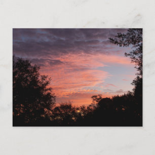 Cloudy red sunrise on a postcard