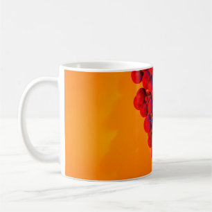 Cluster of blue grape in orange neon light. Food b Coffee Mug