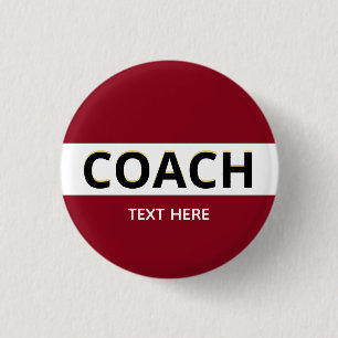 Coach text on burgundy button